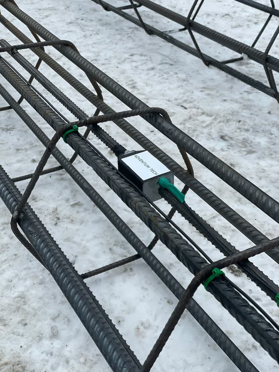 Slab Control concrete temperature sensor SlabControl sensor installed on a metal construction.
